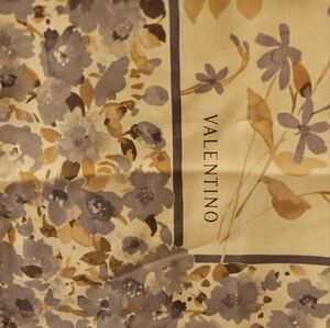 Valentino silk scarf . This is a beautiful scarf . The silk is luxurious !
